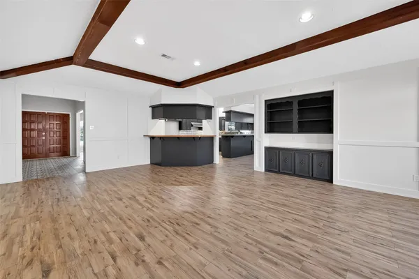a kitchen with a sink and large window