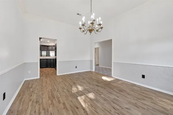 a kitchen with a stove a refrigerator and a sink