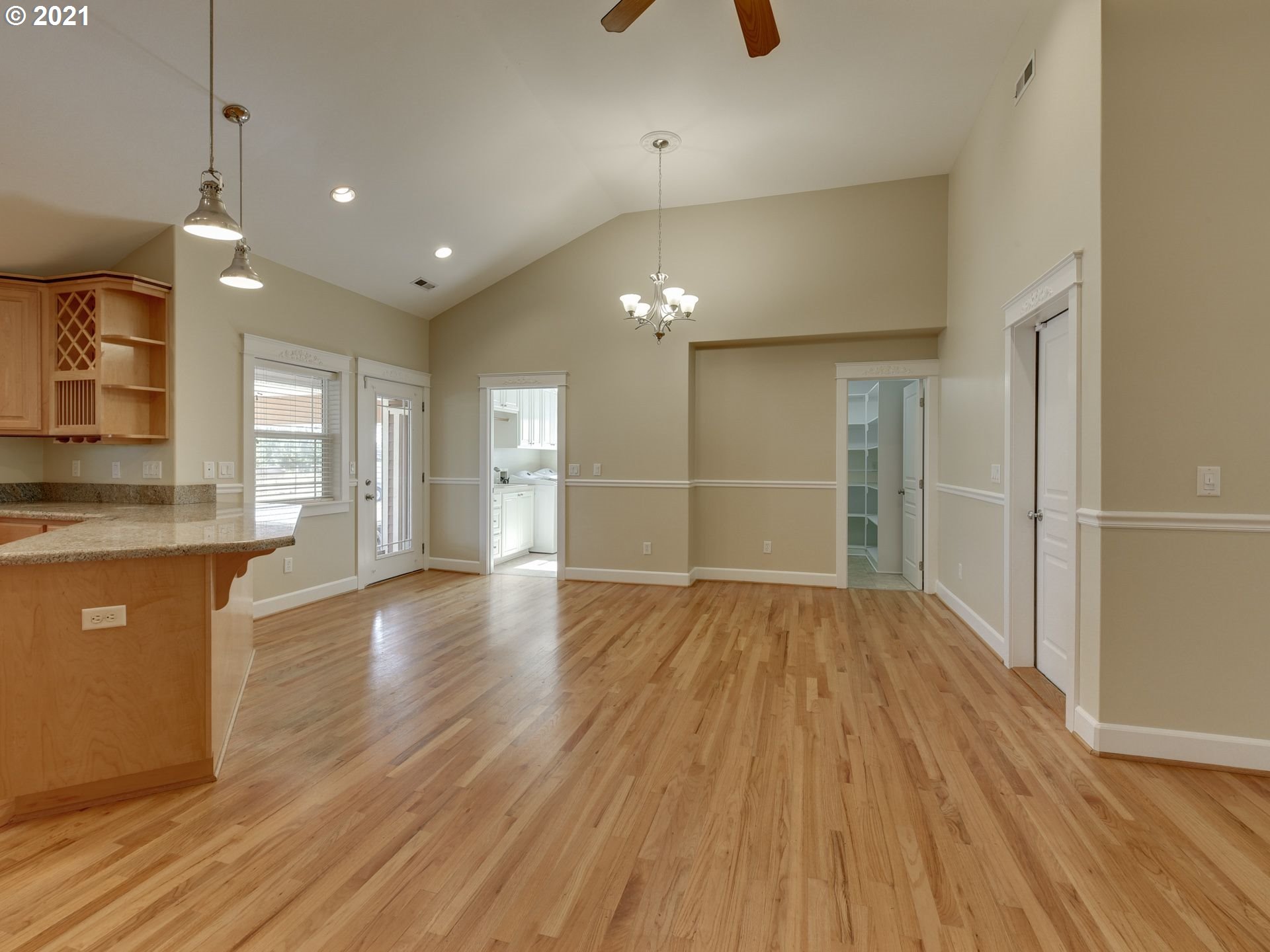 5171 South Elliott Prairie Road Woodburn, OR 97071 - Photo 8 of 32 a view of an empty room with wooden floor and a window