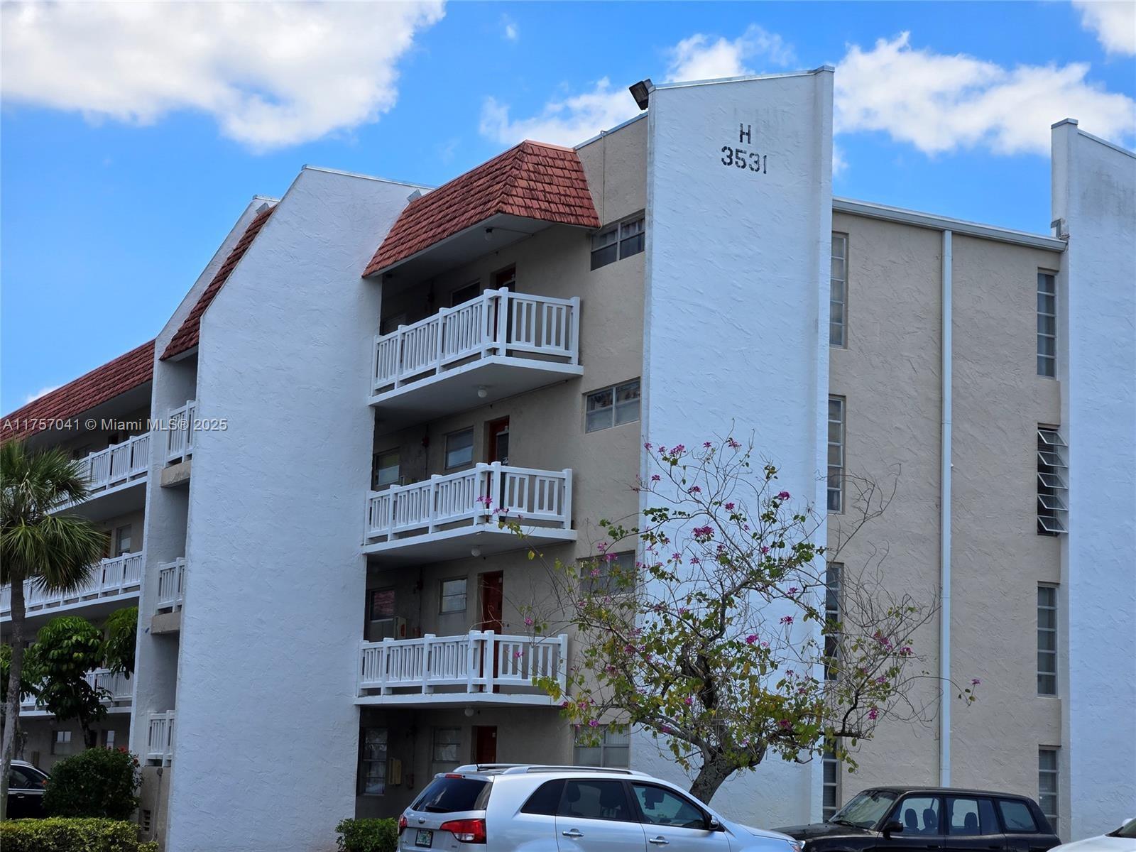 3531 Inverrary Drive, Unit 305 Lauderhill, FL 33319 - Photo 1 of 1 a front view of a house with a yard