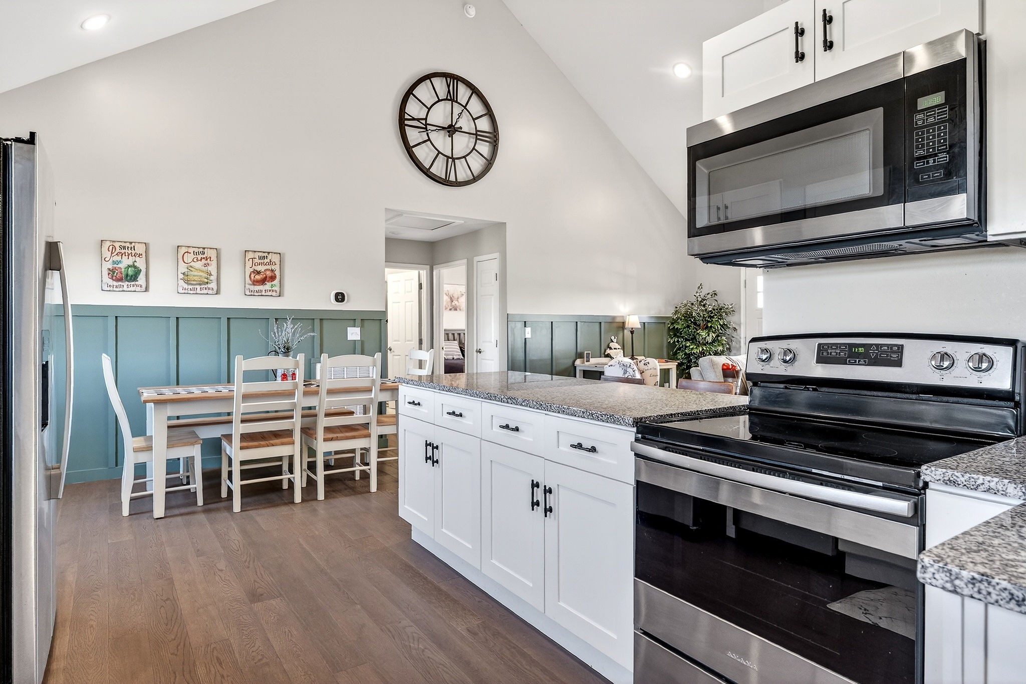 1663 Parker Road Sparta, TN 38583 - Photo 11 of 30 a kitchen with stainless steel appliances a stove a microwave and furniture
