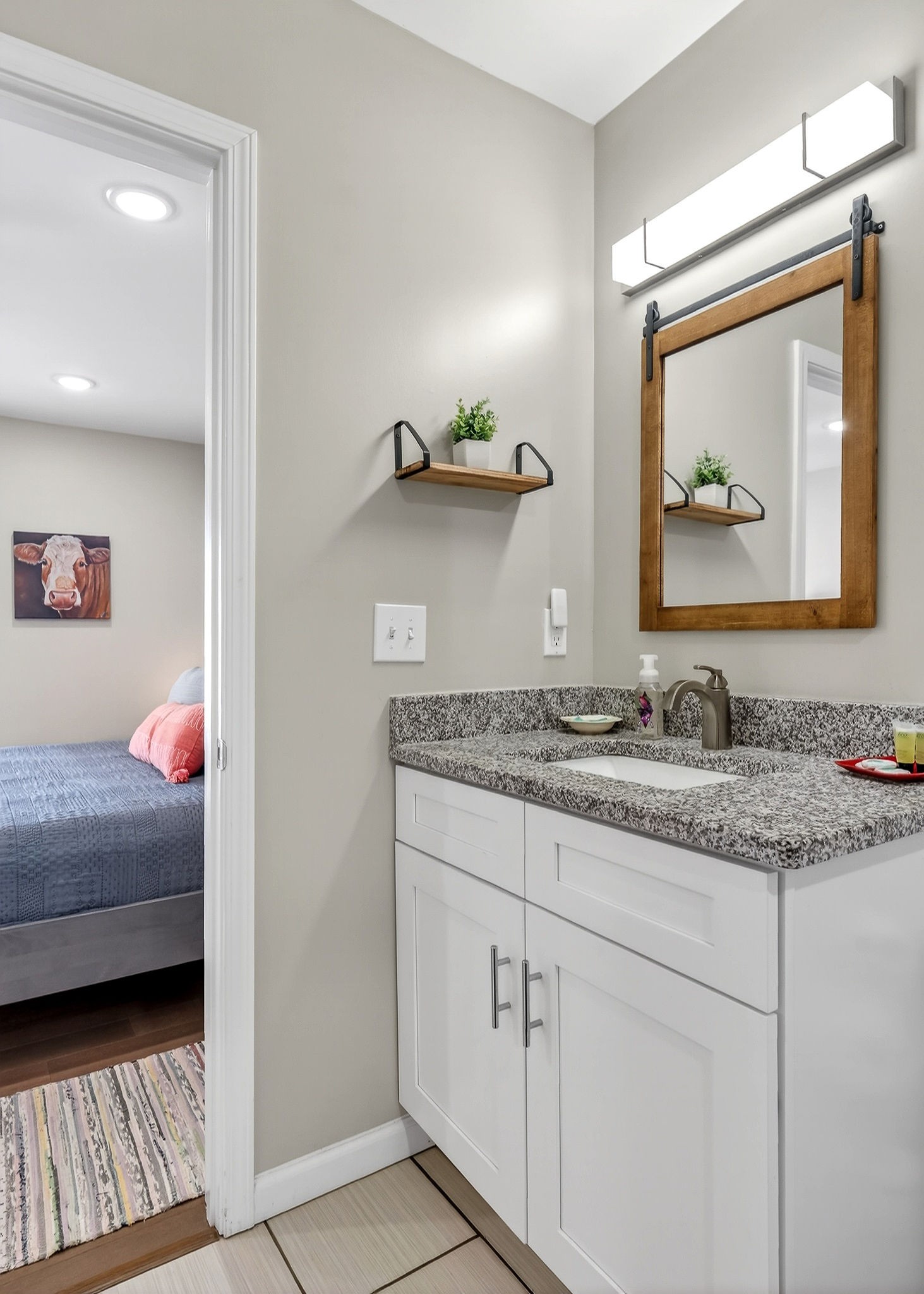 1663 Parker Road Sparta, TN 38583 - Photo 18 of 30 a en suite bathroom with a granite countertop sink and a mirror