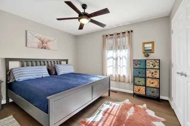 a spacious bedroom with a bed and a window