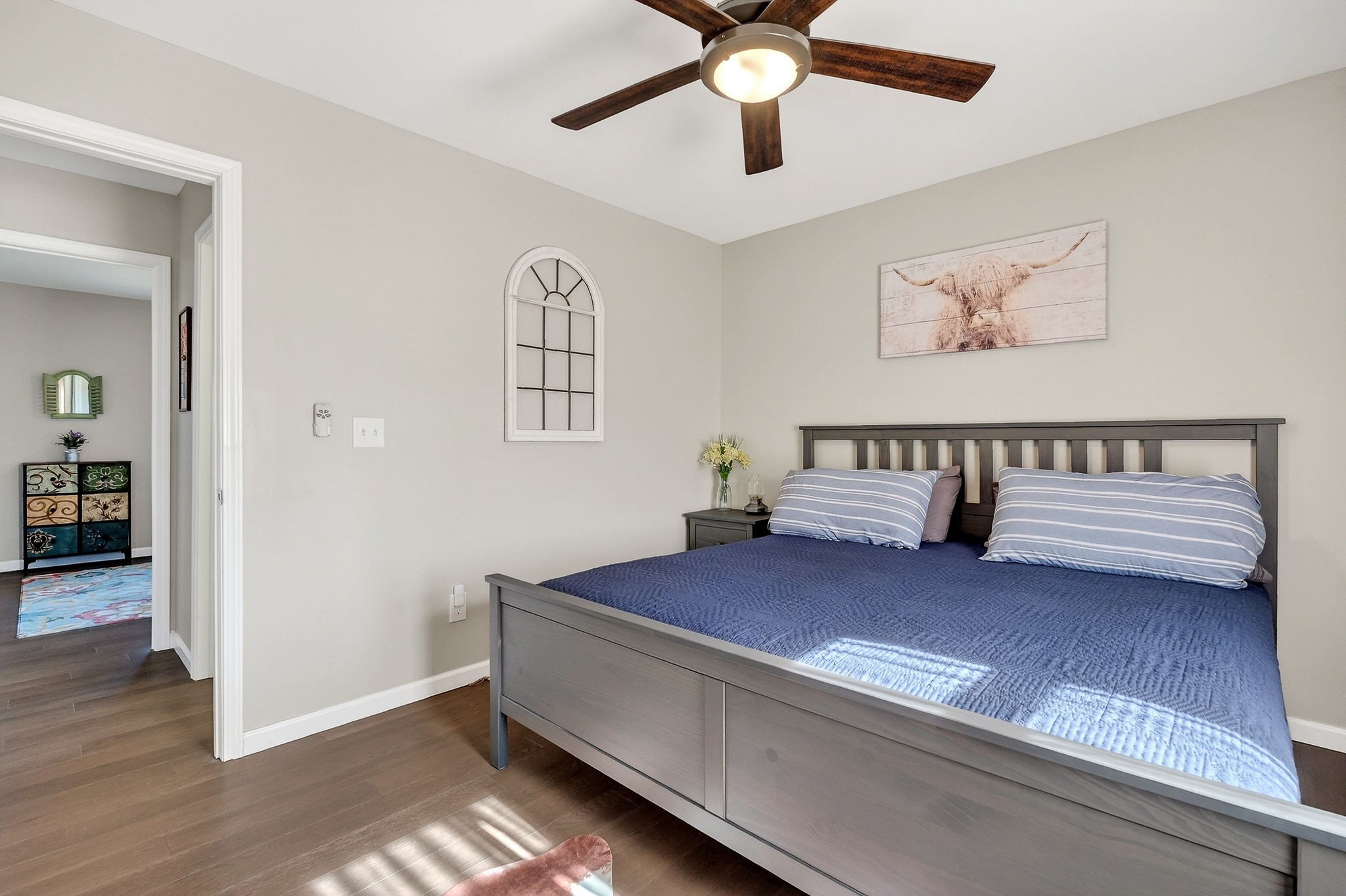 1663 Parker Road Sparta, TN 38583 - Photo 24 of 30 a bedroom with a bed and a chandelier