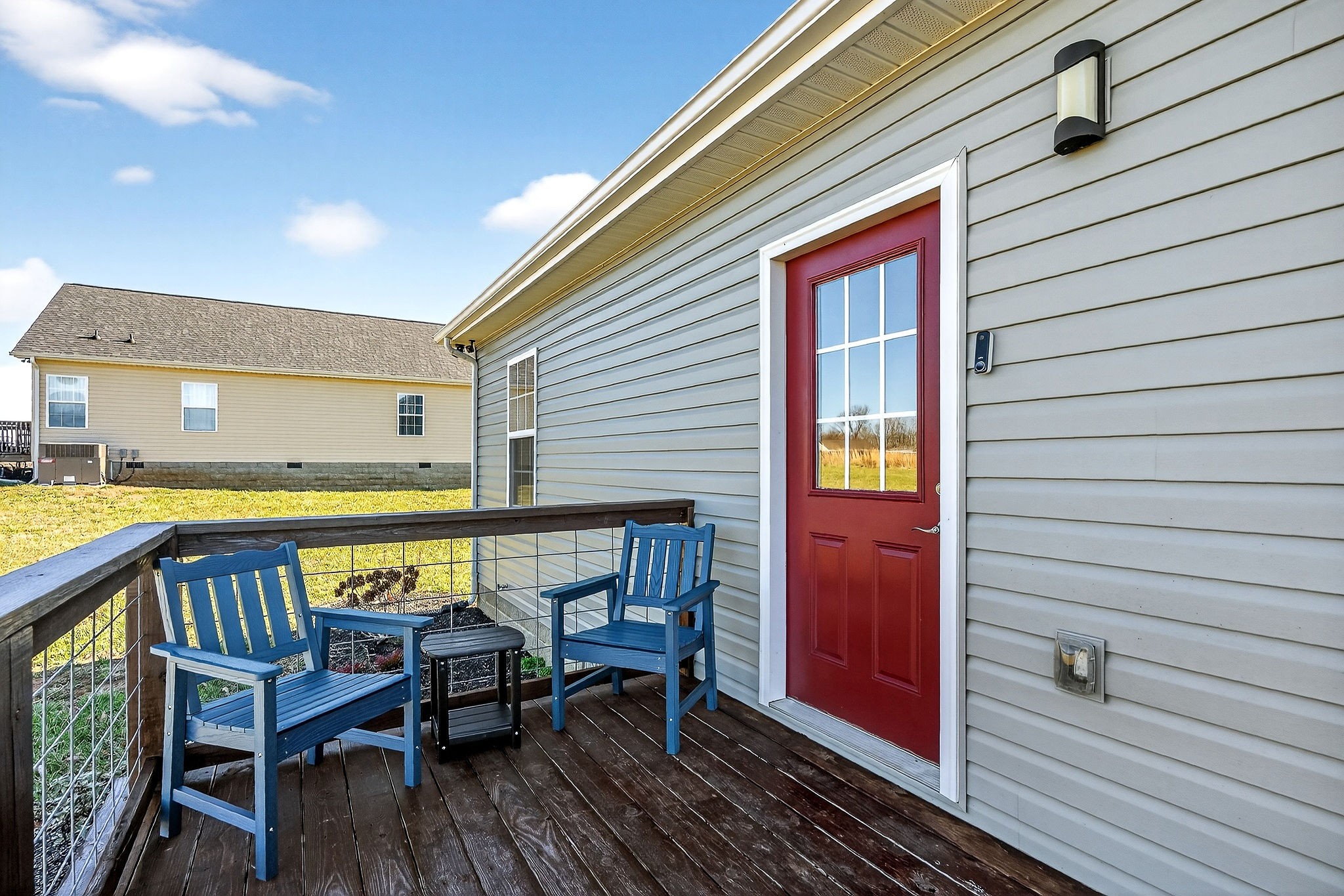 1663 Parker Road Sparta, TN 38583 - Photo 26 of 30 a view of a patio with table and chairs with wooden floor and fence