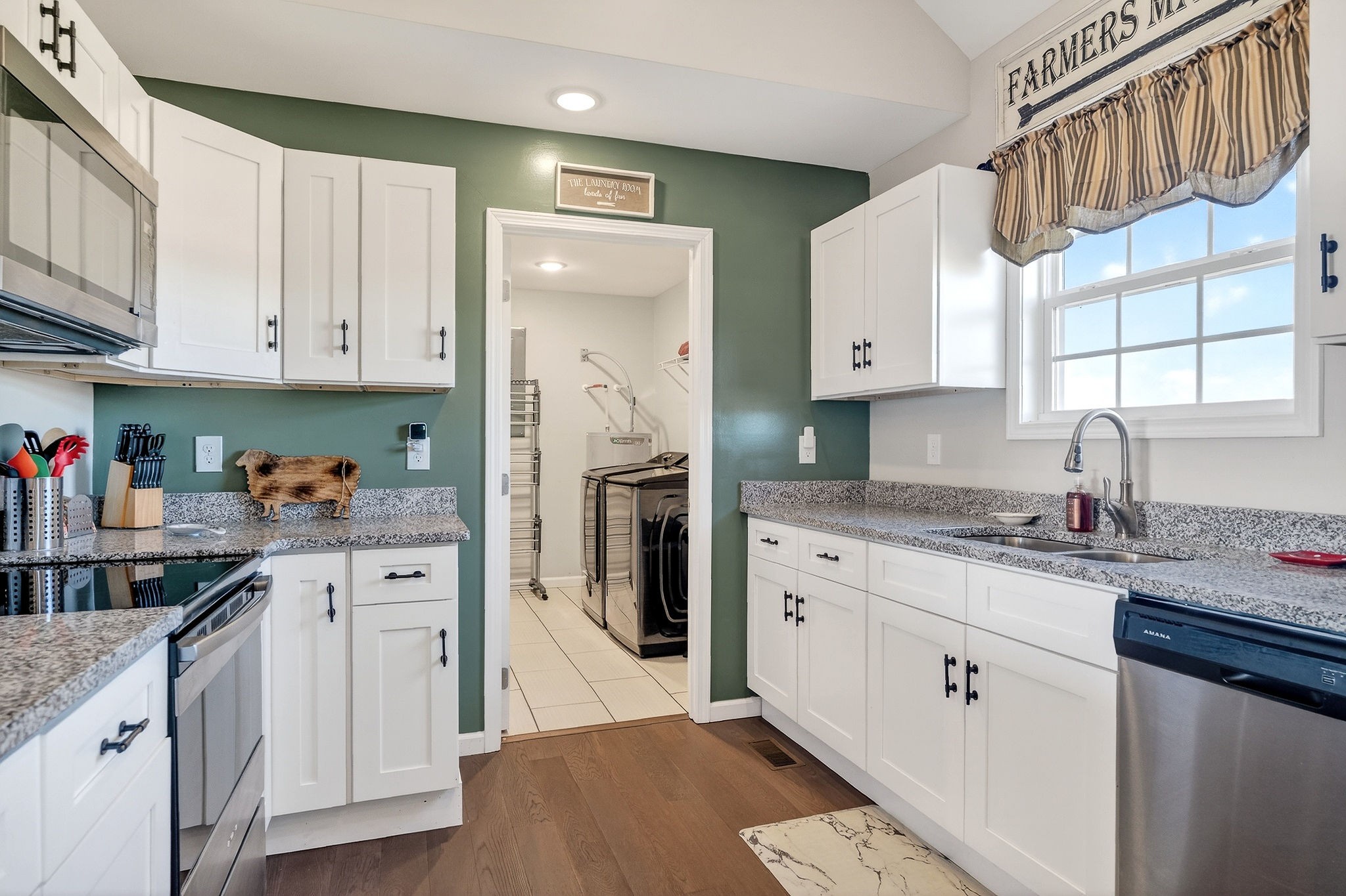 1663 Parker Road Sparta, TN 38583 - Photo 10 of 30 a kitchen with stainless steel appliances granite countertop a sink stove and cabinets