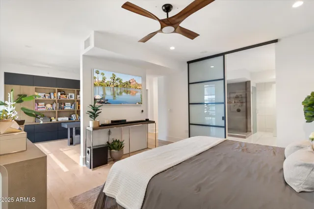 a bed room with a bed and a television