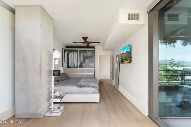 a view of a hallway with a livingroom and furniture