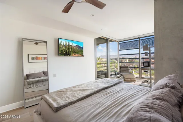 a bedroom with a bed a dresser and book shelf