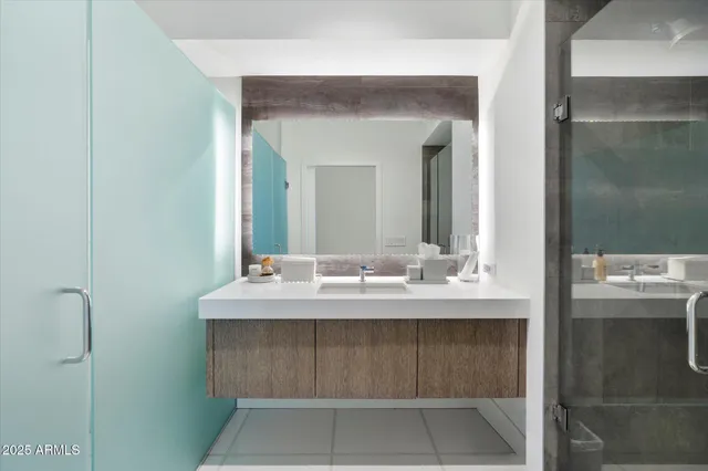 a bathroom with a sink and a mirror