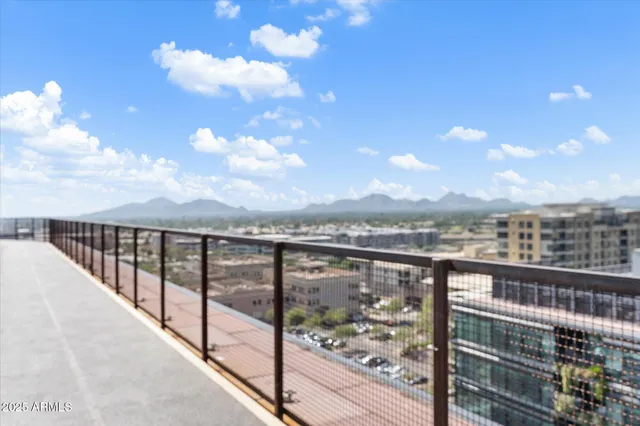 a view of a city skyline from a balcony
