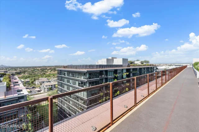 a view of a patio with table and chairs and potted plants