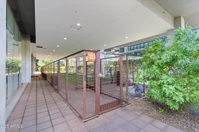 a living room with fireplace furniture and a large window