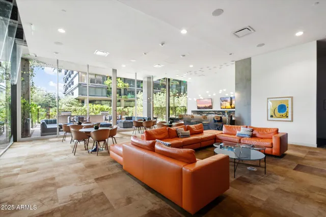 a living room with furniture and a large window