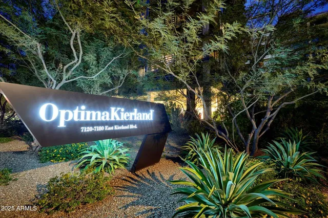 a sign that is sitting in front of a building