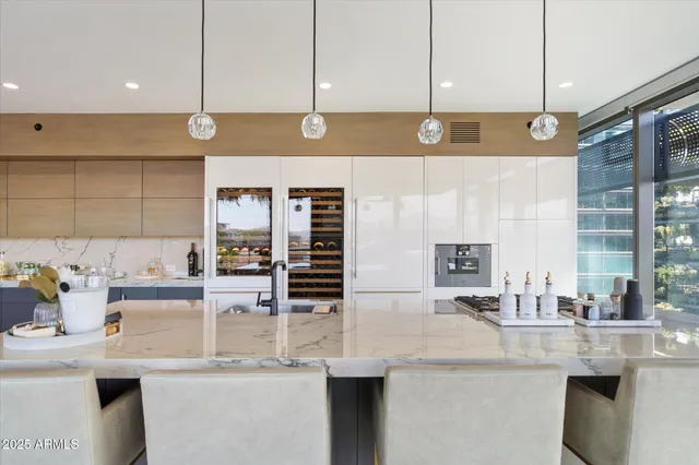 a kitchen with stainless steel appliances kitchen island granite countertop a sink and cabinets