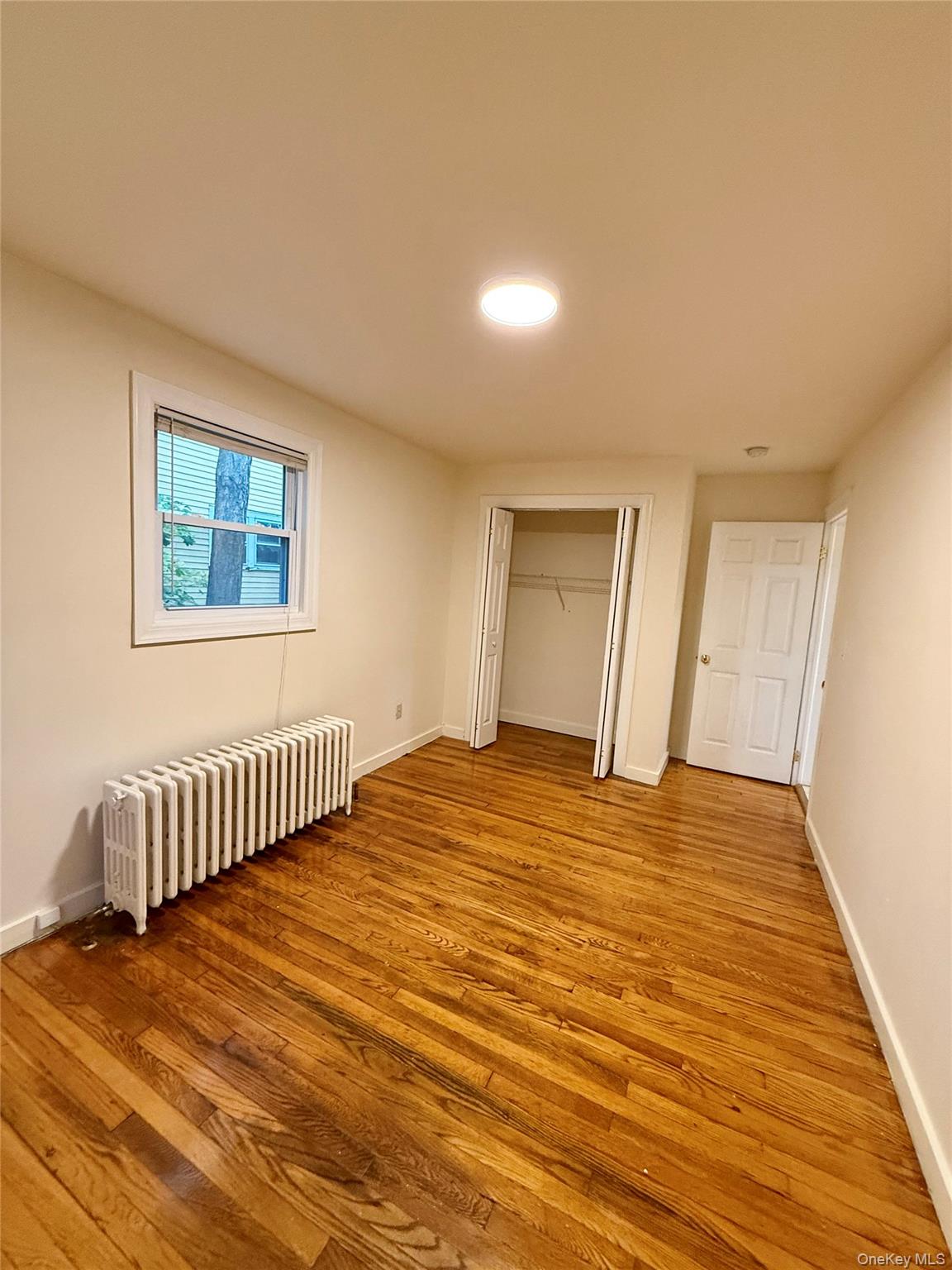 80 Teller Avenue, Unit 1 Beacon, NY 12508 - Photo 15 of 19 a view of empty room with wooden floor
