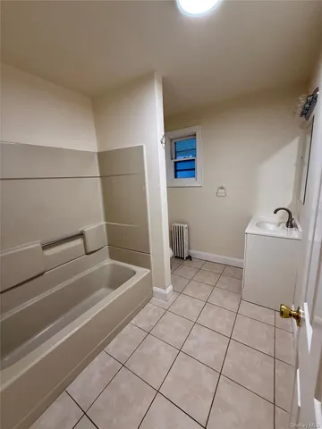 a bathroom with a sink and toilet