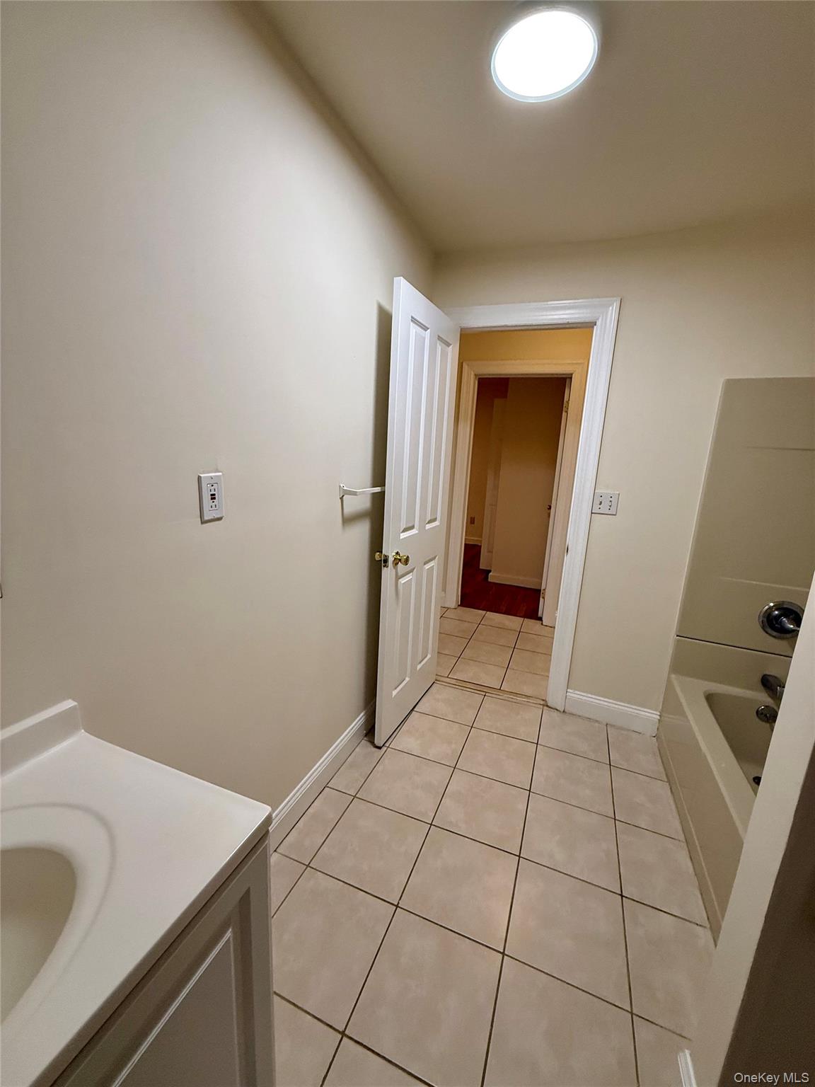 80 Teller Avenue, Unit 1 Beacon, NY 12508 - Photo 17 of 19 a bathroom with a sink and a washing machine