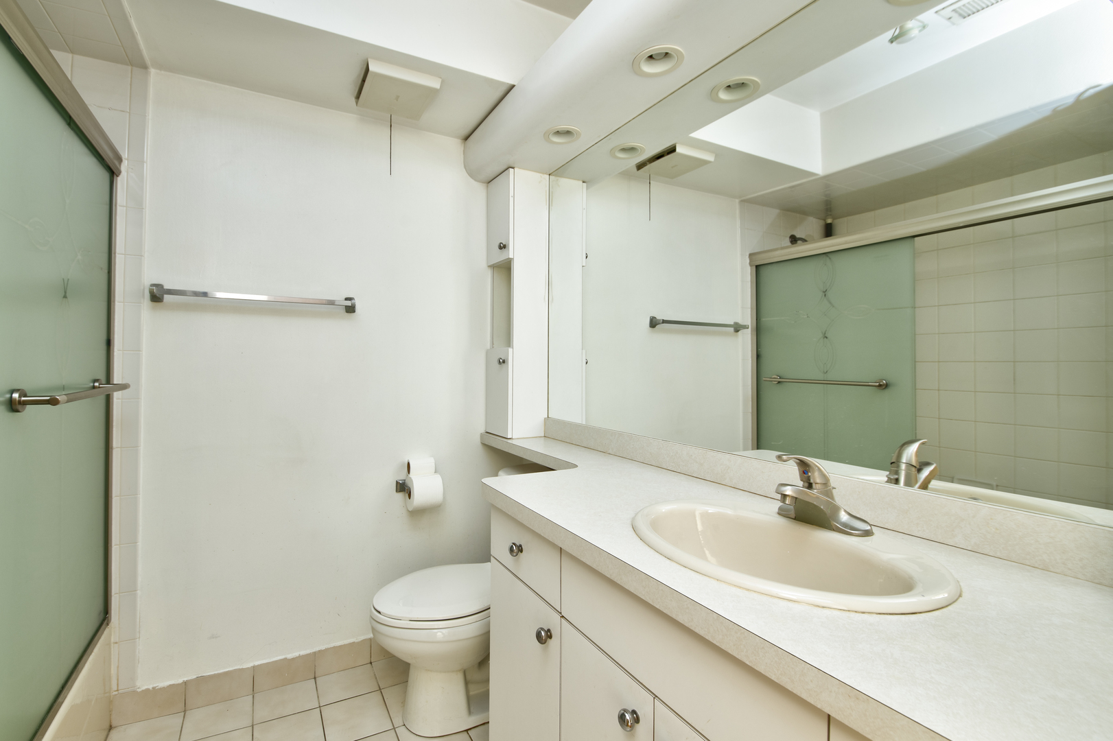 3207 North Pontiac Avenue, Unit 2S Chicago, IL 60634 - Photo 11 of 13 a bathroom with a sink toilet and shower