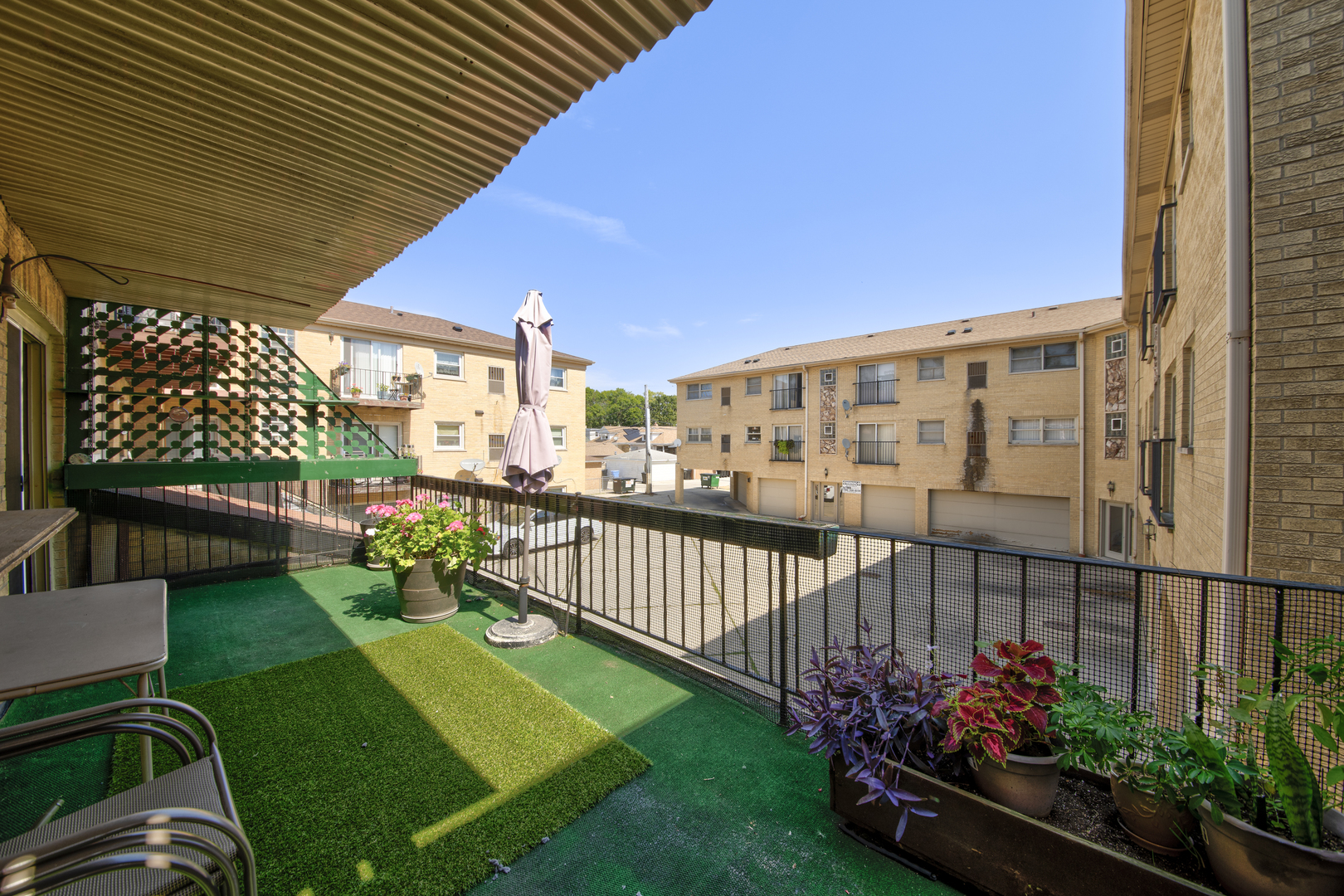 3207 North Pontiac Avenue, Unit 2S Chicago, IL 60634 - Photo 12 of 13 a view of a porch with a bench