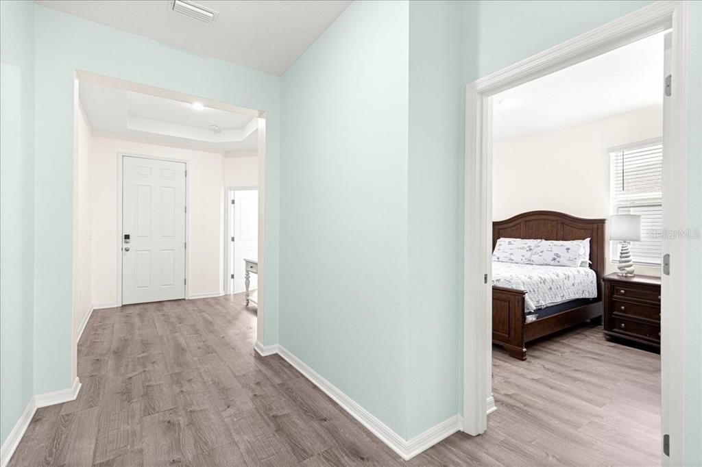 5851 Southwest 85th Place Ocala, FL 34476 - Photo 22 of 57 a bedroom with a bed and a view of bedroom
