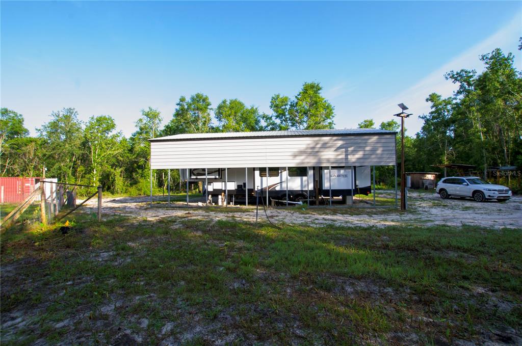 18233 185th Road Live Oak, FL 32060 - Photo 30 of 99 a aerial view of a house with swimming pool and deck