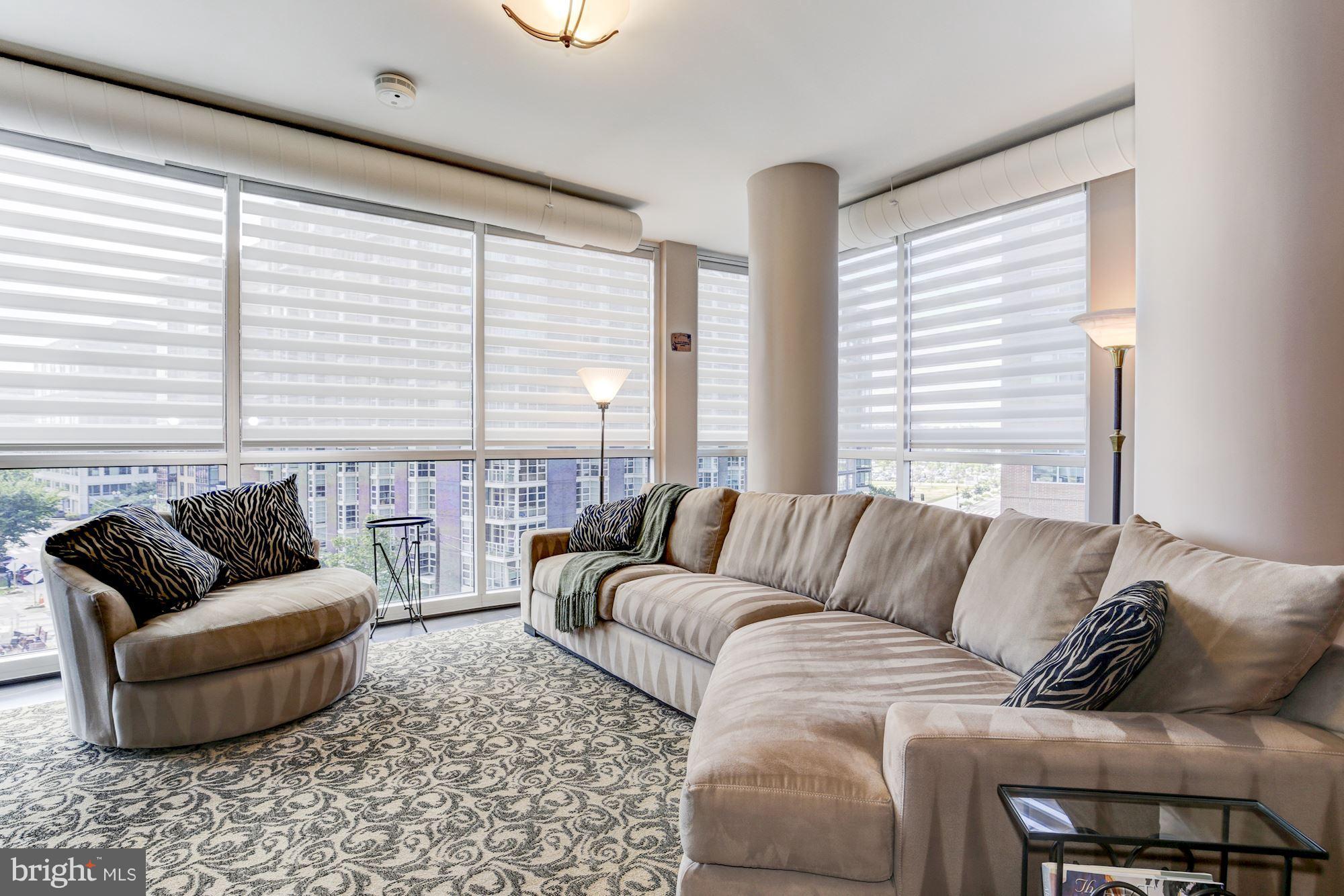 1025 First Street Southeast, Unit 613 Washington, DC 20003 - Photo 12 of 30 a living room with furniture and a large window