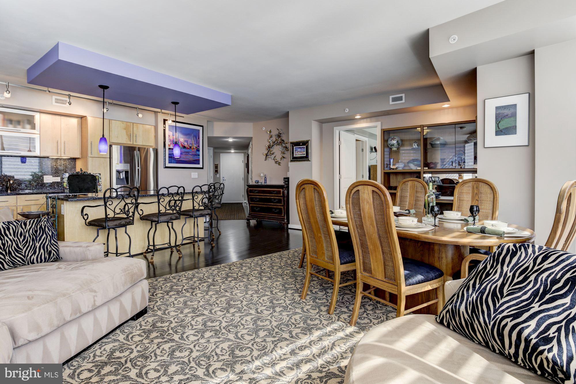 1025 First Street Southeast, Unit 613 Washington, DC 20003 - Photo 13 of 30 a living room with furniture a rug and white walls