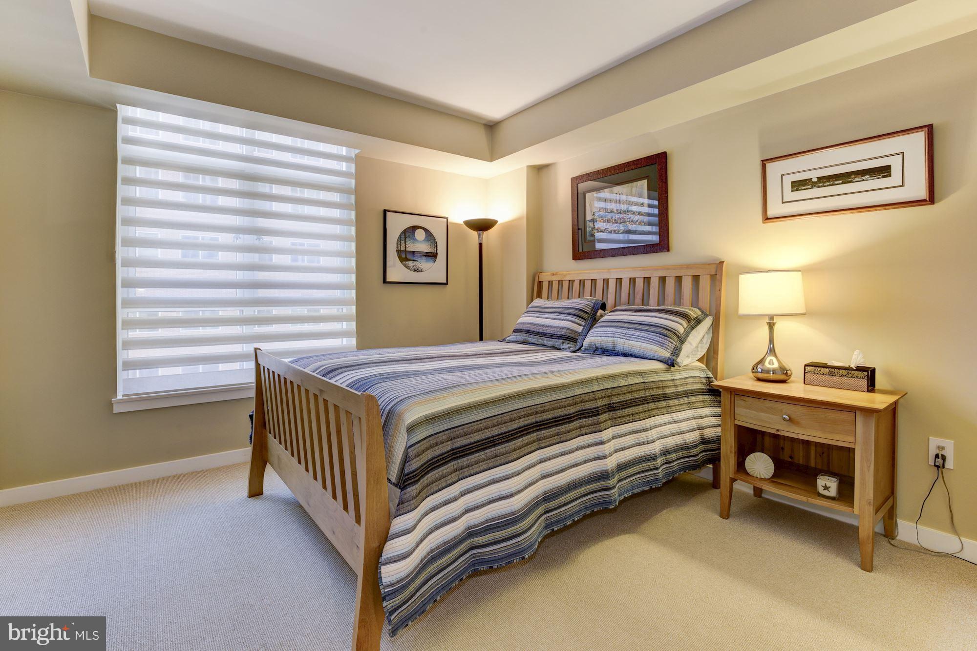 1025 First Street Southeast, Unit 613 Washington, DC 20003 - Photo 18 of 30 a bedroom with a bed and a window
