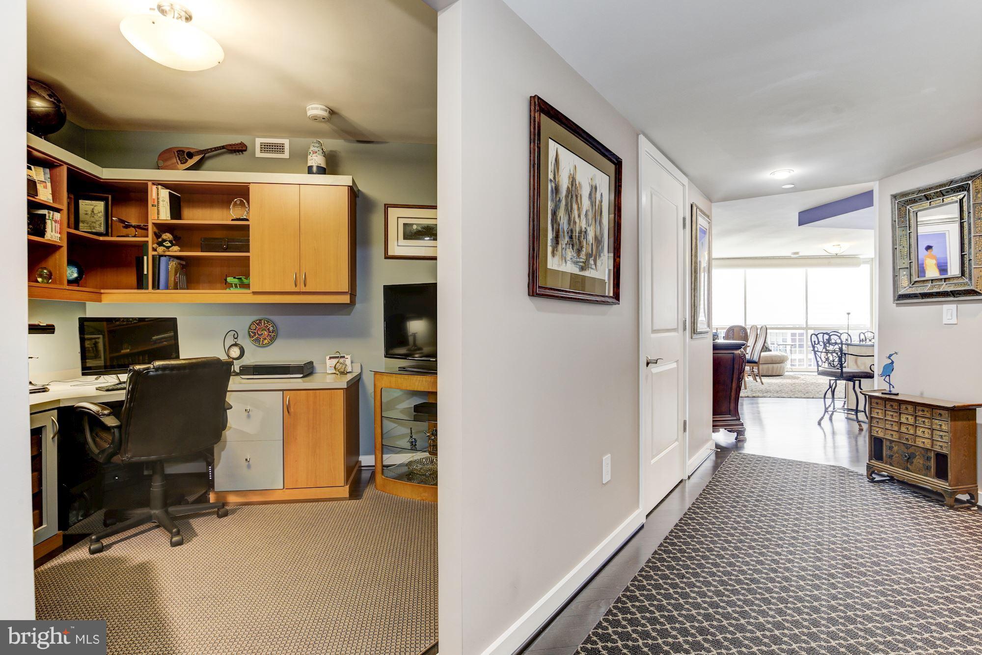 1025 First Street Southeast, Unit 613 Washington, DC 20003 - Photo 3 of 30 a view of a workspace with furniture and a window