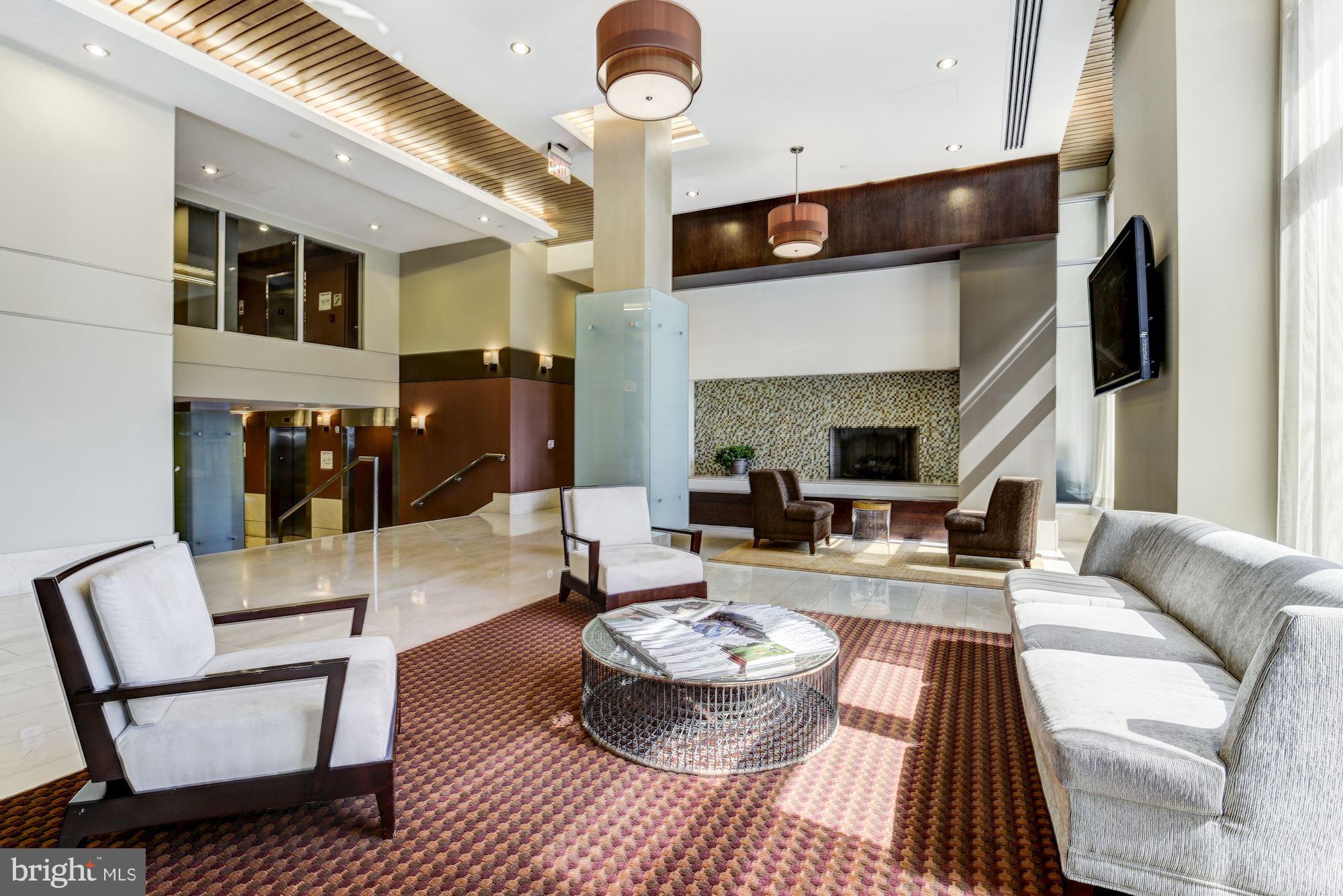 1025 First Street Southeast, Unit 613 Washington, DC 20003 - Photo 23 of 30 a living room with furniture and wooden floor