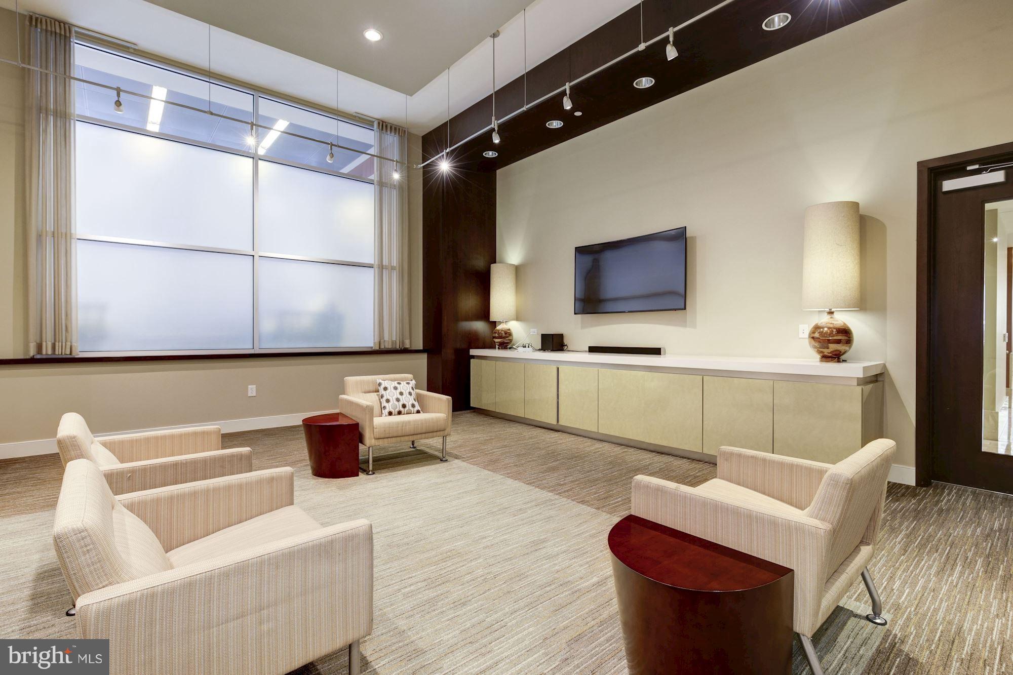 1025 First Street Southeast, Unit 613 Washington, DC 20003 - Photo 26 of 30 a living room with furniture and a flat screen tv