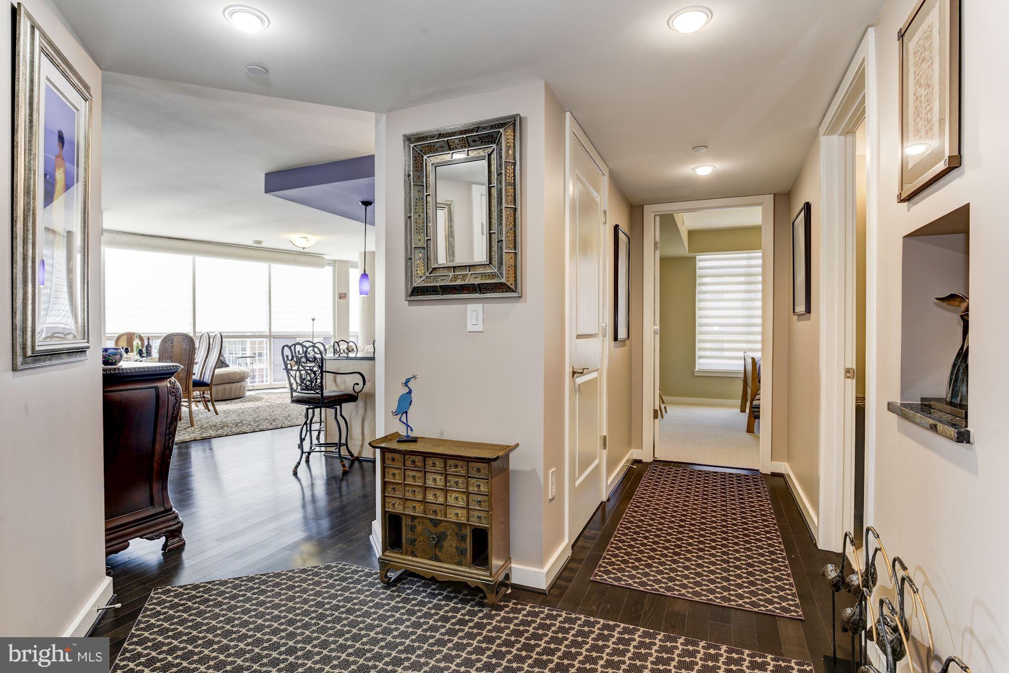 1025 First Street Southeast, Unit 613 Washington, DC 20003 - Photo 6 of 30 a living room with furniture a rug and a table