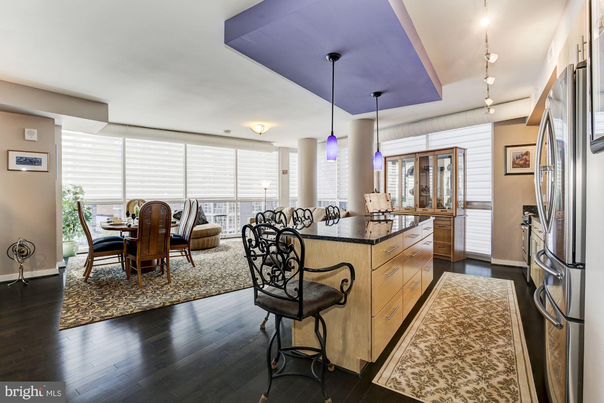 1025 First Street Southeast, Unit 613 Washington, DC 20003 - Photo 7 of 30 a living room with furniture a rug and a chandelier