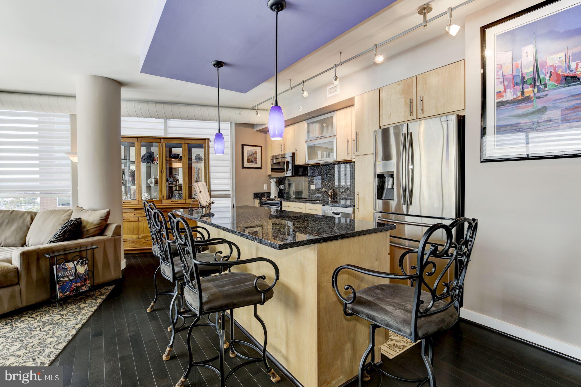 1025 First Street Southeast, Unit 613 Washington, DC 20003 - Photo 8 of 30 a view of a dining room with furniture window and wooden floor