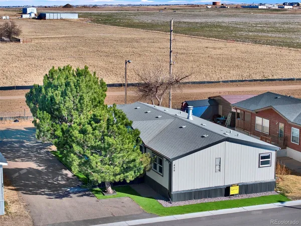 a aerial view of a house with a lake view