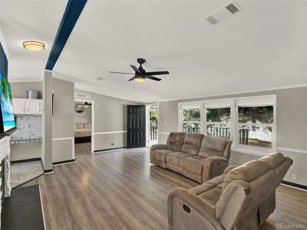 a living room with furniture and a large window
