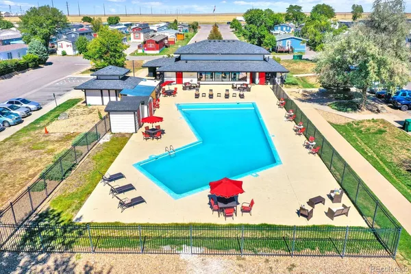 a view of swimming pool with sitting area