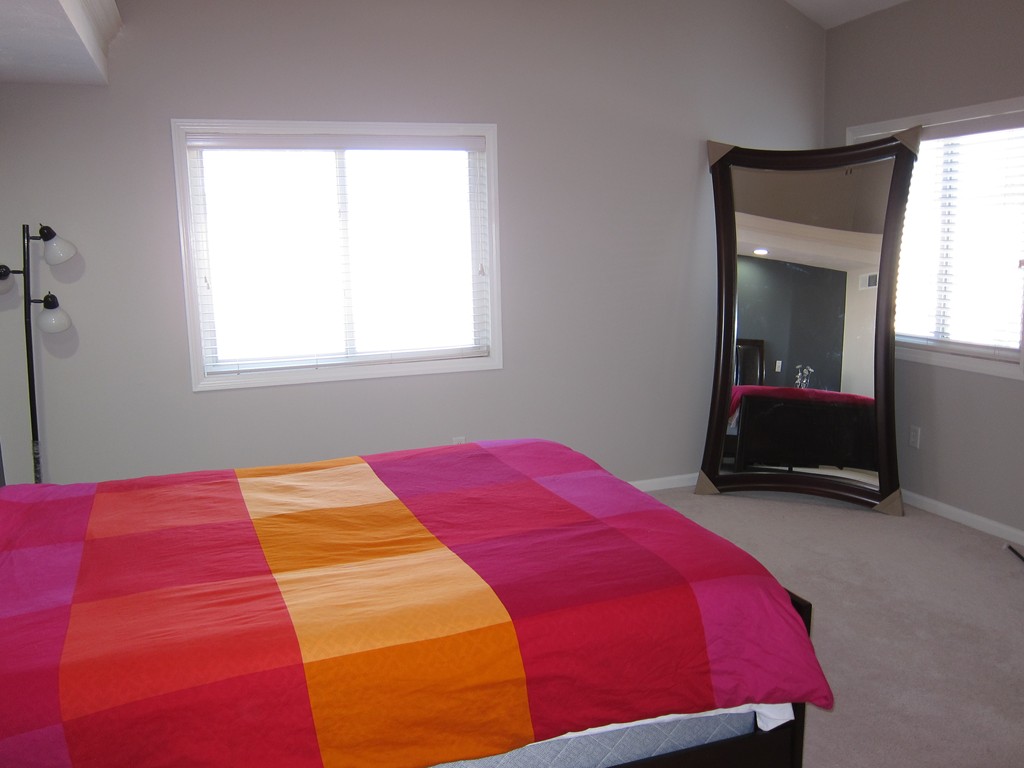 69 Half Crown Circle, Unit 69 Ashland, MA 01721 - Photo 18 of 25 a bedroom with a bed and a window