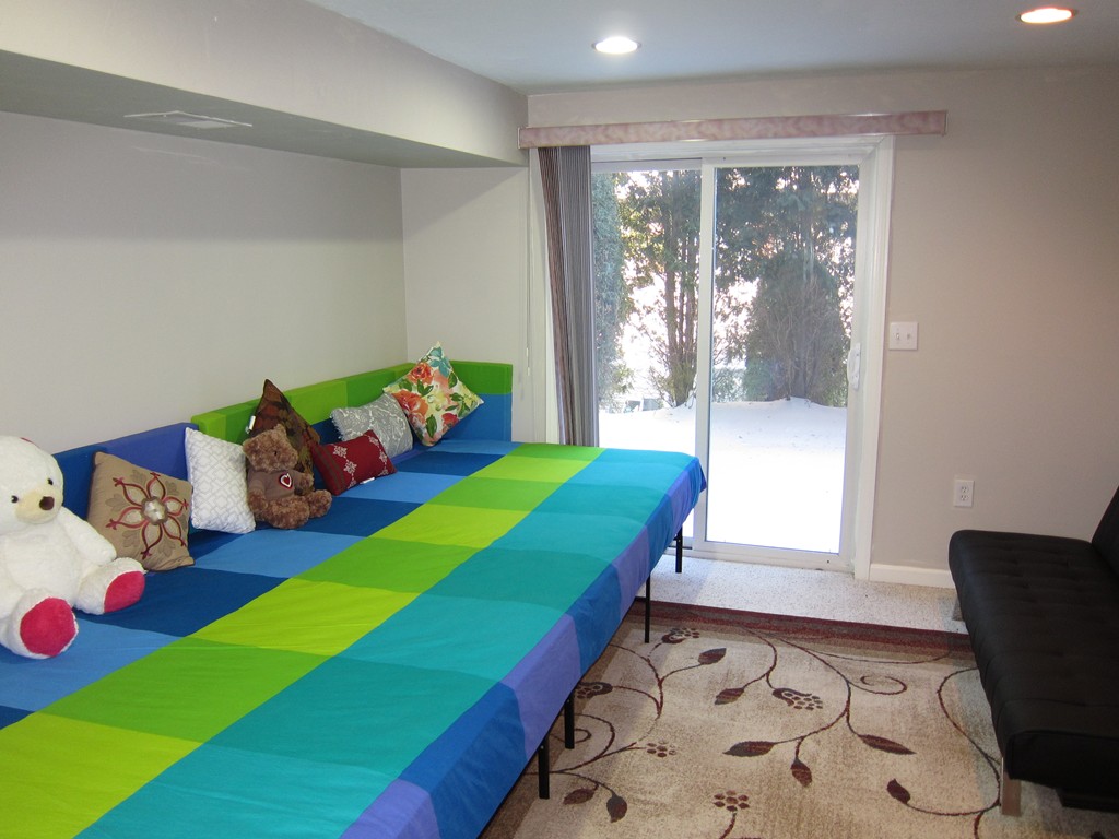 69 Half Crown Circle, Unit 69 Ashland, MA 01721 - Photo 24 of 25 a room with a bed and a window