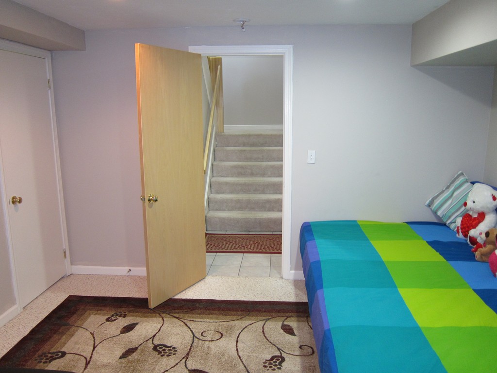 69 Half Crown Circle, Unit 69 Ashland, MA 01721 - Photo 25 of 25 a room with toys and a wooden floor