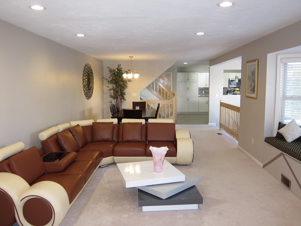 69 Half Crown Circle, Unit 69 Ashland, MA 01721 - Photo 4 of 25 a living room with furniture and a large window