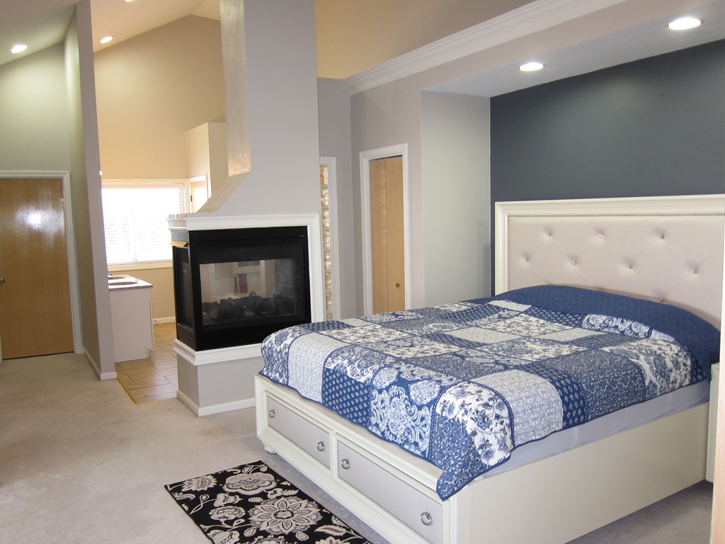 69 Half Crown Circle, Unit 69 Ashland, MA 01721 - Photo 10 of 25 a bedroom with a bed and a television