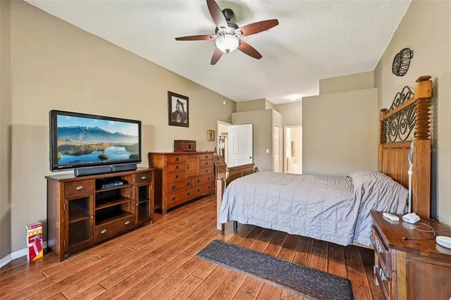 a bedroom with a bed and a night stand