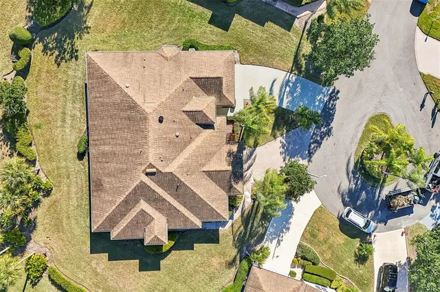 an aerial view of a residential houses with outdoor space