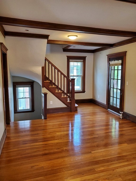22 Allen Street, Unit 2 Arlington, MA 02474 - Photo 4 of 25 a view of an entryway with wooden floor and a window