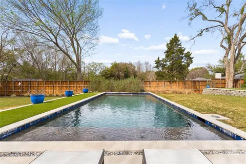 a view of a swimming pool with a terrace
