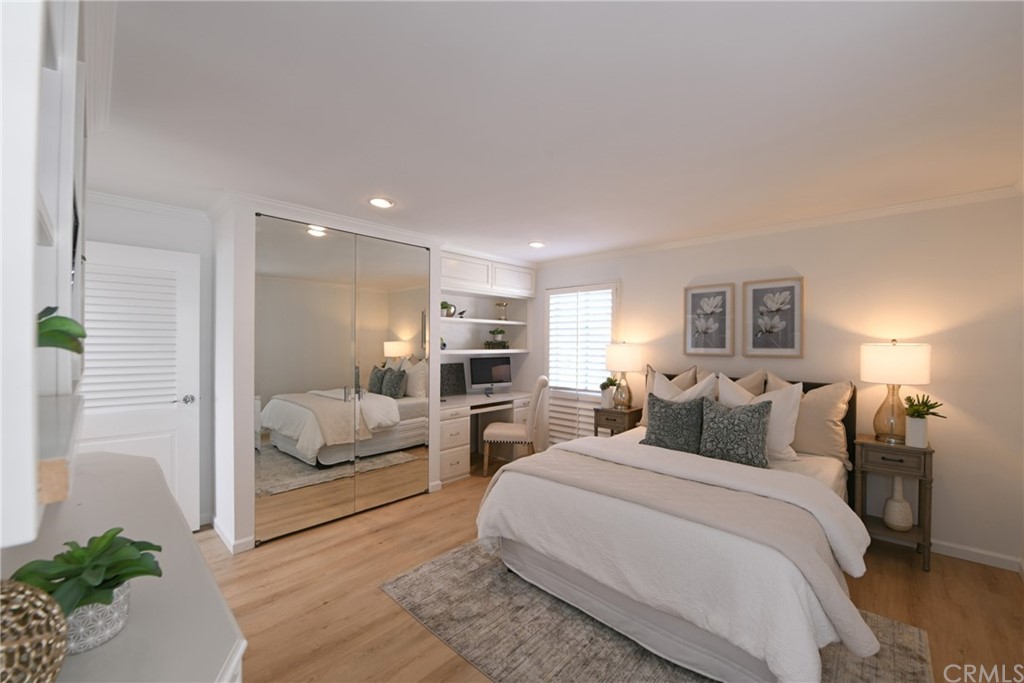 267 Avenida Lobeiro, Unit E San Clemente, CA 92672 - Photo 18 of 56 a bedroom with a large bed and potted plant