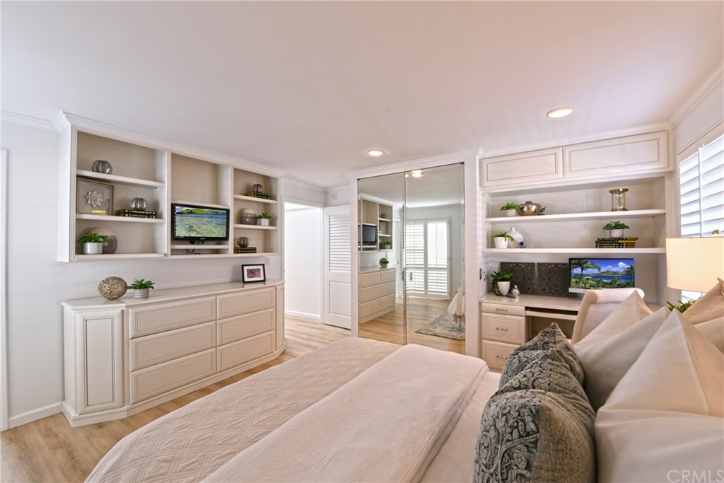 267 Avenida Lobeiro, Unit E San Clemente, CA 92672 - Photo 20 of 56 a large bedroom with a bed and a view of kitchen